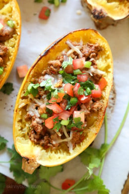 These are my favorite new way to eat spaghetti squash! Filled with the most flavorful turkey taco meat, cheese and topped with pico de gallo.