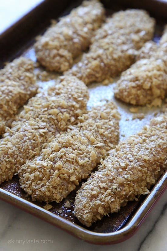 These baked chicken tenders are coated with seasoned crushed tortilla chips, baked until golden and served with salsa! An easy, weeknight chicken dish, great for the kids, or even adults.