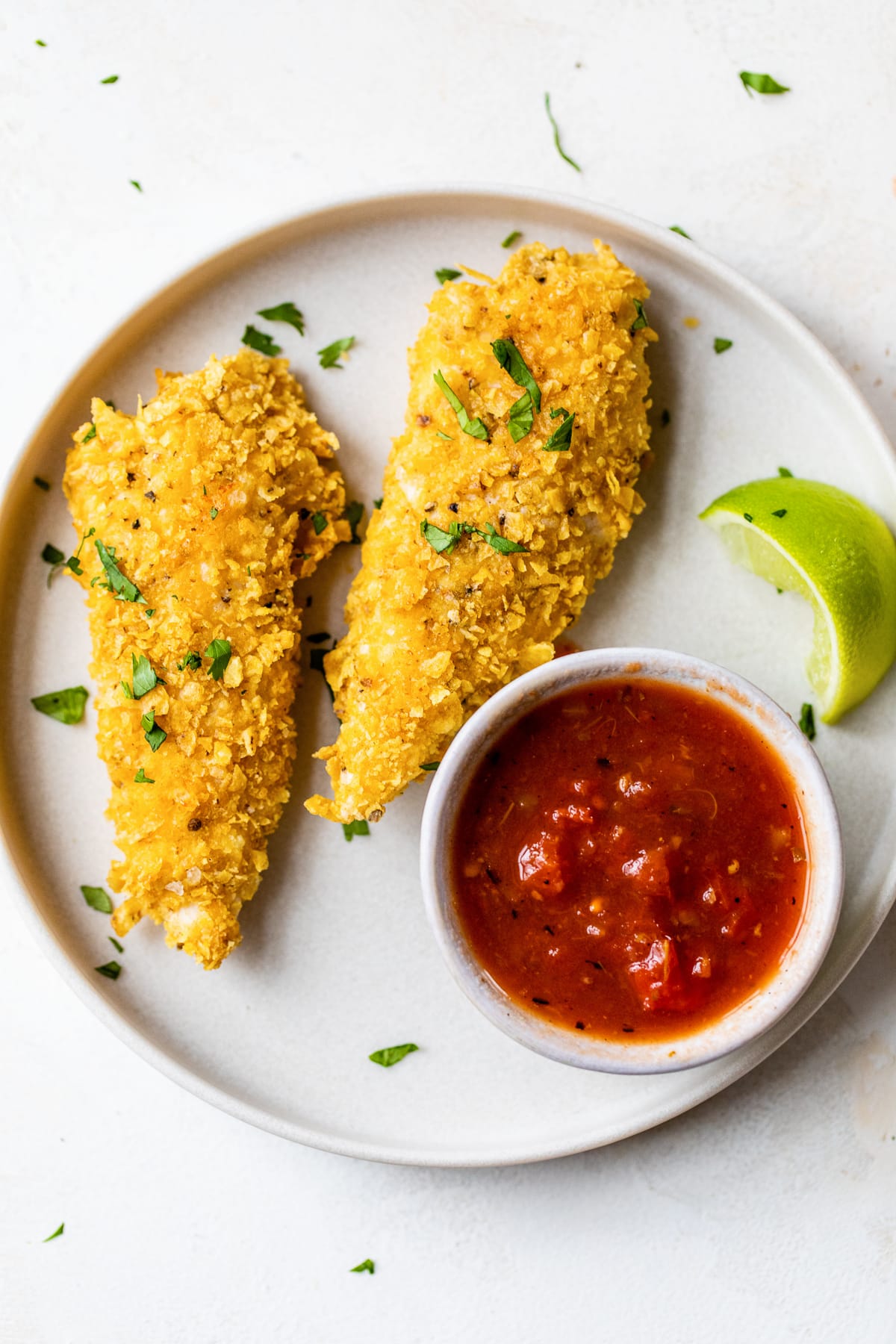 Tortilla-crusted chicken tenders with salsa
