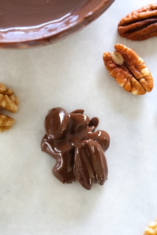 Almonds, pecans and walnuts are dipped in dark melted chocolate and finished with a touch of sea salt for the tastiest Holiday treats!