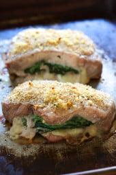 These stuffed pork chops are SO good, inspired my a meal I had at a local Italian restaurant stuffed with prosciutto, mozzarella and baby spinach then topped with garlic and breadcrumbs.