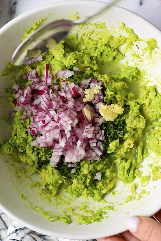 mashed avocados with red onion, garlic