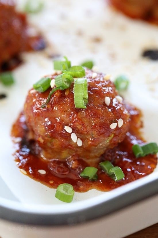 These Asian inspired turkey meatballs are seasoned with ginger and spices and finished with a sweet and spicy, gochujang glaze. Great as an appetizer or serve them with brown rice to make them a meal.