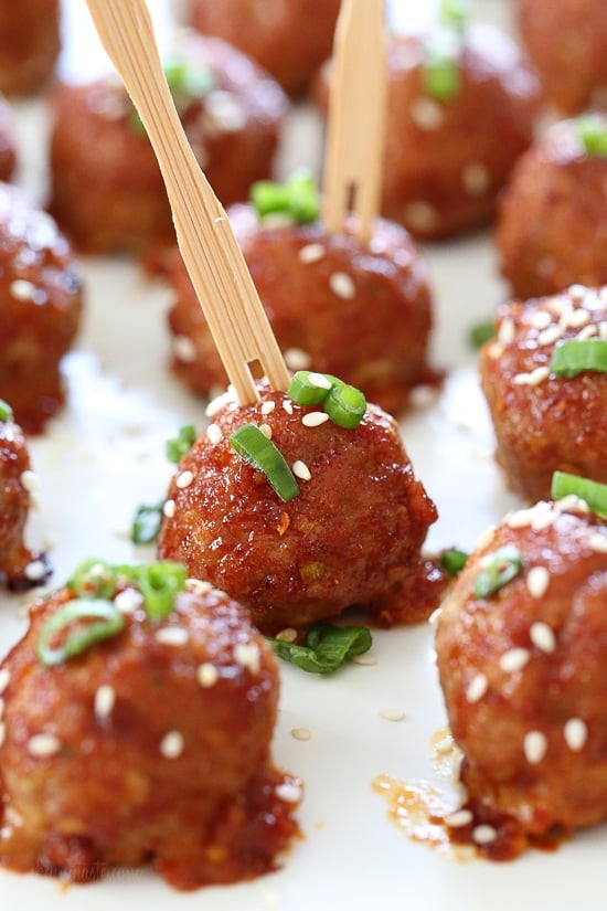 These turkey meatballs are seasoned with ginger and spices and finished with a sweet and spicy, gochujang glaze. These are great as an appetizer or serve them with brown rice to make them a meal.
