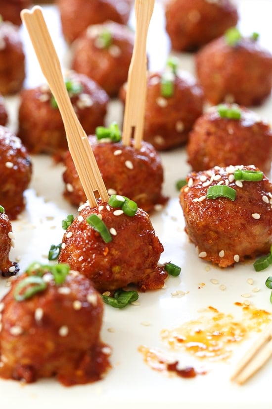 These turkey meatballs are seasoned with ginger and spices and finished with a sweet and spicy, gochujang glaze. These are great as an appetizer or serve them with brown rice to make them a meal.