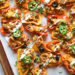 Loaded mini bell pepper nachos – game changer!! These low-carb nachos are loaded with turkey taco meat, cheese and all your favorite nacho toppings!