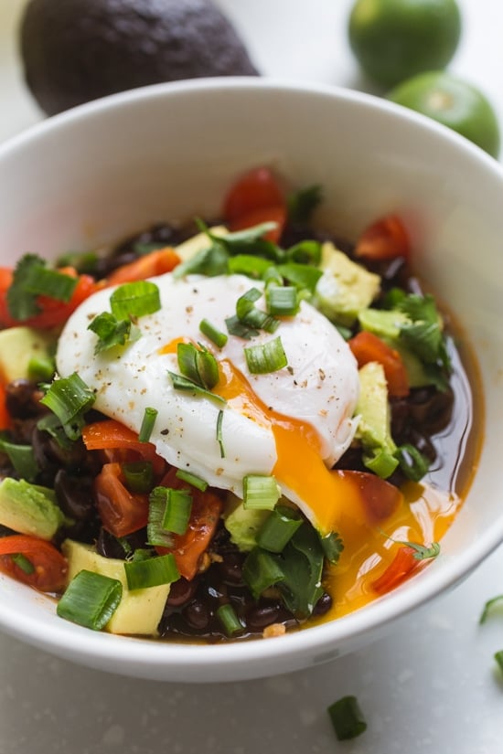 Instant pot black beans served with a poached egg and veggies