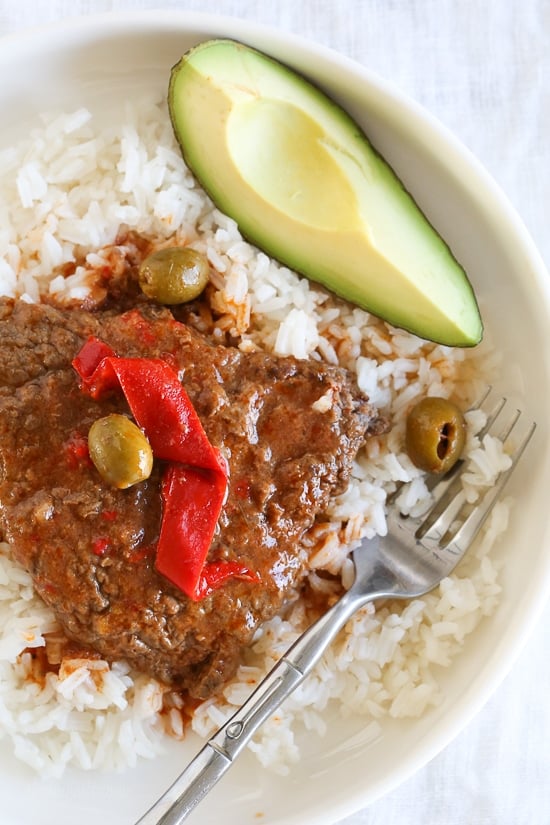 Braised Cubed Steak with Peppers, Onions and Olives is a flavorful, budget-friendly and family friendly dish you can make in the Instant Pot, Slow Cooker or in a pot on the stove.