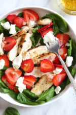 Grilled Chicken Salad with Strawberries and Spinach is made with creamy goat cheese and a white balsamic dressing, but this would also be great with Feta cheese and if you want to add more protein, or skip the cheese add walnuts or slivered almonds.