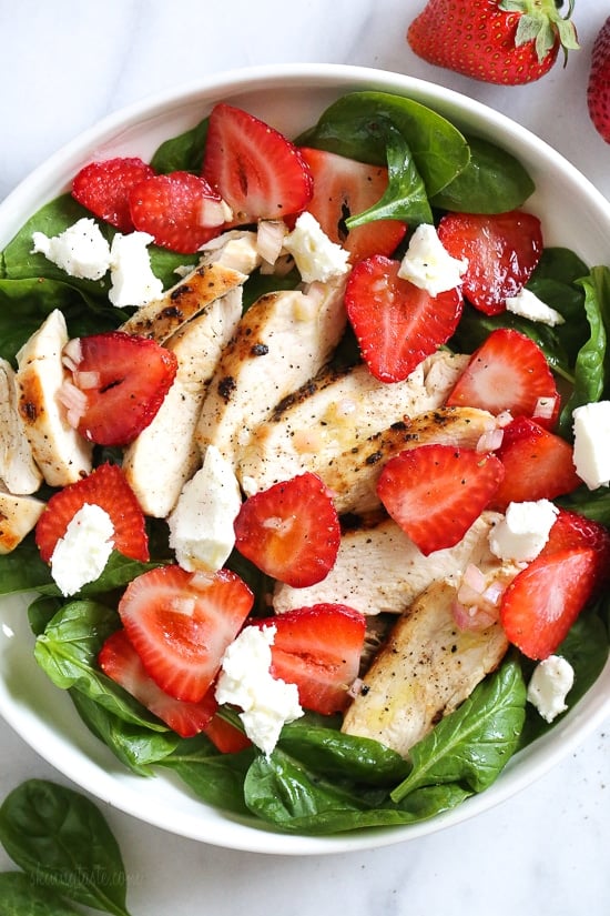 Grilled Chicken Salad with Strawberries and Spinach is all I've been craving now that Spring is in full bloom! I made this with creamy goat cheese and a white balsamic dressing, but this would also be great with Feta cheese and if you want to add more protein, or skip the cheese add walnuts or slivered almonds.