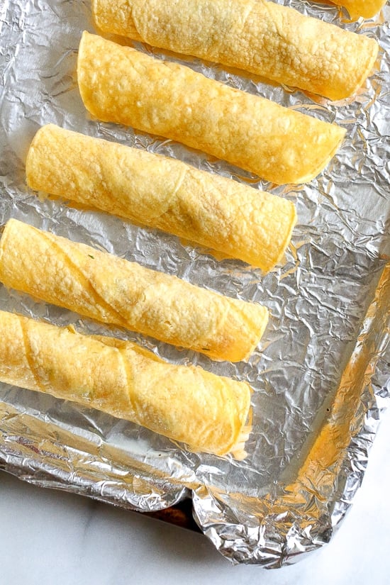 Baked Shrimp Taquitos are so much lighter and healthier than frying, and they come out perfect and crisp! The shrimp filling is SO good you'll be tempted to eat it before you roll them up. I plan on making the filling again to use for shrimp tacos this week!