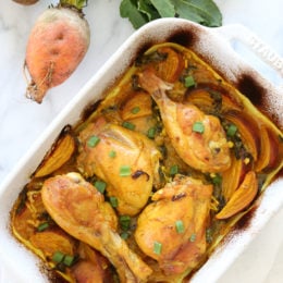 Turmeric Braised Chicken with Golden Beets and Leeks is a flavorful dish layered with vegetables and spices, covered with wine and baked in a casserole dish.