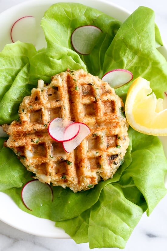 Dust off that waffle machine to make these fast and delicious Waffled Crab Cakes! This is so genius you're going to wonder why you haven't thought of this sooner. The crab cakes cook perfectly in the center, with golden edges in less than 3 minutes! And you get perfect little square pockets to hold the lemon juice or tartar sauce.