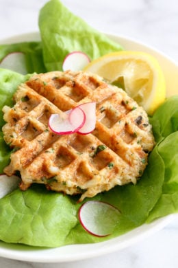 Dust off that waffle machine to make these fast and delicious Waffled Crab Cakes! This is so genius you're going to wonder why you haven't thought of this sooner. The crab cakes cook perfectly in the center, with golden edges in less than 3 minutes! And you get perfect little square pockets to hold the lemon juice or tartar sauce.