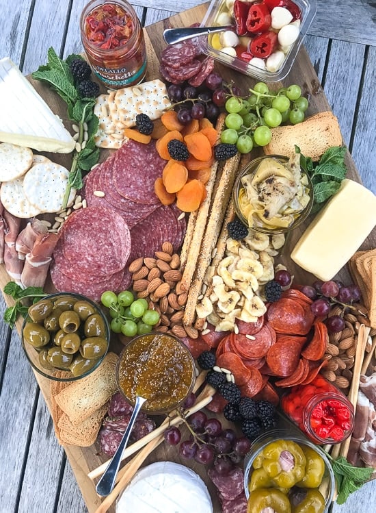 Meat and cheese boards are my go-to for stress-free summer entertainment. Add wine and a baguette and you have a meal.