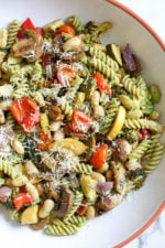 One bite of this Balsamic Roasted Veggie and White Bean Pasta and you'll want to make it all summer long! It's LOADED with veggies in every bite and finished with pesto and white beans. Roasted zucchini, yellow squash, zucchini, cherry tomatoes, red onion, mushrooms, peppers, and broccoli – SO good, and picky husband approved!