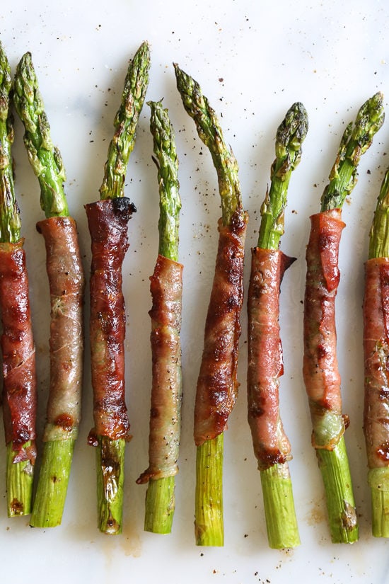 These 3-ingredient prosciutto-wrapped asparagus are the perfect addition to a delicious side dish or charcuterie platter.