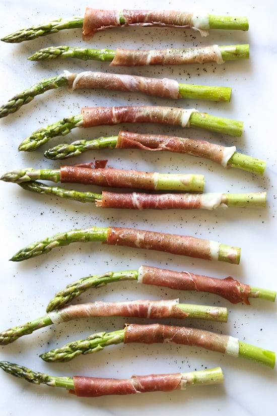 These Prosciutto Wrapped Asparagus, an easy 3-ingredient side dish, can be grilled outside or indoors if you have a grill pan. Perfect as a side dish, or as an appetizer (makes a great addition to your charcuterie platter!)