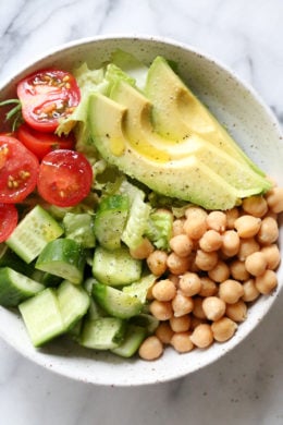 This Chickpea and Avocado salad is my go-to lunch when I need something fast and healthy! I load it up with garden vegetables and top it with a little olive oil and lemon, or olive oil and vinegar depending on my mood. Super simple, fresh and fills me up!