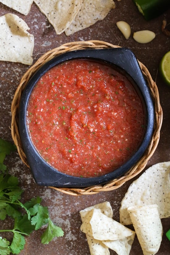 Get the chips ready for this quick and easy No-Cook Restaurant-Style Salsa recipe! In less than five minutes, you will have a delicious, healthy appetizer or snack everyone will love. It's bright, fresh and perfect for parties!