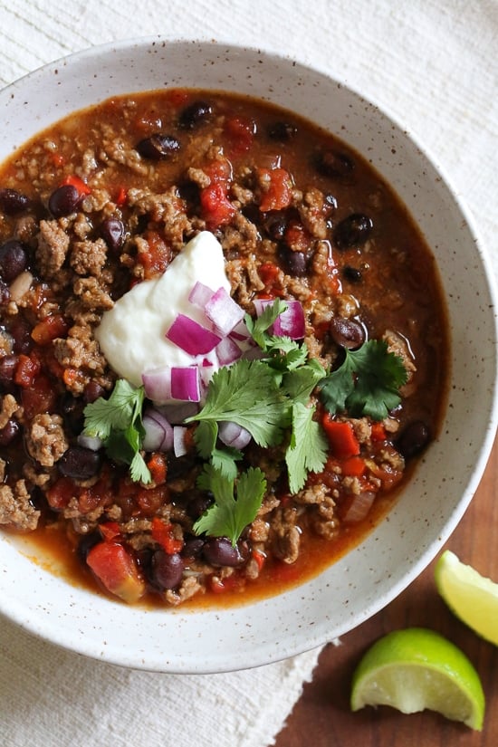 I love this quick and easy beef chili made with black beans, tomatoes, homemade chili spices and beer. This chili pleases all the palates in my house – not to too spicy (although you can kick it up if you wish), loaded with flavor, and ready in less than 30 minutes.