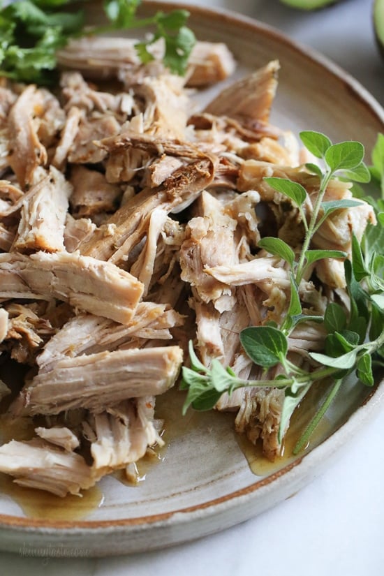 Tender shredded pork, marinated in garlic, cumin, grapefruit and lime and cooked in the pressure cooker is perfect to serve over a bed of rice or with tortillas and salsa and avocados for taco night.
