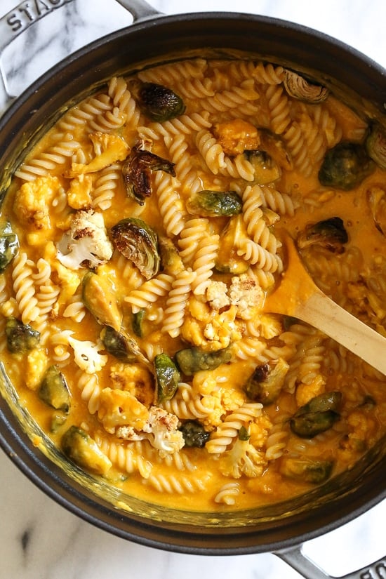 It's October, so Pumpkin Mac and Cheese with Roasted Cauliflower and Brussels Sprouts is a must for the Fall! Using pumpkin puree makes a creamy light cheese sauce, without having to add cream or too much cheese. You can make your own pumpkin puree or use organic canned pumpkin to make it faster!