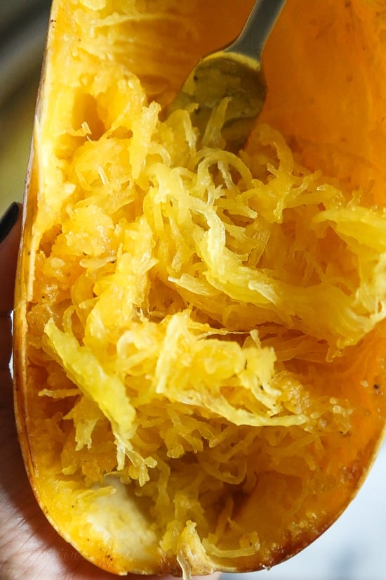 Roasted spaghetti squash with bacon and Parmesan cheese is a tasty recipe and easy side dish. Although there are several methods to cook spaghetti squash, my favorite way to make it is roasted. To roast the squash, I cut it on half lengthwise, remove the seeds and cook it cut down for about one hour.