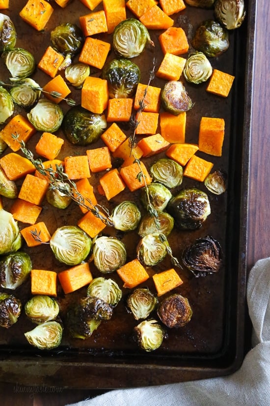 Roasted Brussels Sprouts and Butternut Squash are tossed with olive oil, salt and pepper for an easy Fall side dish! Simply place them on a sheet pan and bake until tender and the Brussels are slightly charred on the edges.