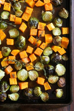 Roasted Brussels Sprouts and Butternut Squash are tossed with olive oil, salt and pepper for an easy Fall side dish! Simply place them on a sheet pan and bake until tender and the Brussels are slightly charred on the edges.
