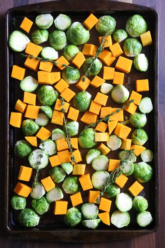 Roasted Brussels Sprouts and Butternut Squash are tossed with olive oil, salt and pepper for an easy Fall side dish! Simply place them on a sheet pan and bake until tender and the Brussels are slightly charred on the edges. 