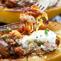 I swapped traditional pasta for roasted spaghetti squash to enjoy this cozy and delicious Beef and Mushroom Ragu served with a dollop of ricotta and grated Pecorino Romano – you won't miss the pasta!