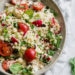 This EASY and fresh couscous is so easy and tasty, and it goes with just about everything. You can serve it with fish, chicken, beef, lamb, or pork, or you can serve it as a meat-free and light main dish.