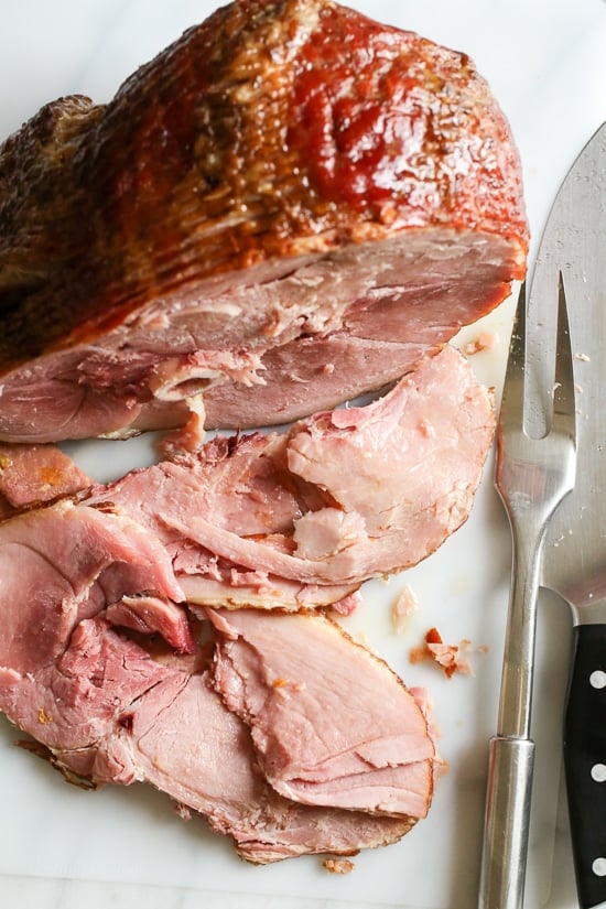 This is the EASIEST Slow Cooker Spiral Ham recipe, just two-ingredients plus the ham! Perfect for the Holidays, and it won't take up space in your oven.