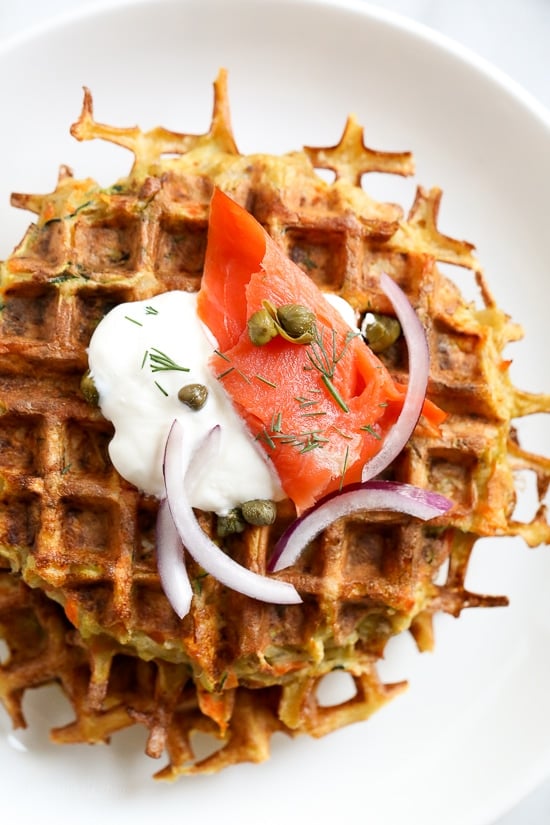 These vegetable-filled latkes aren't your traditional latkes, made from grated potatoes, carrots, zucchini, and peppers, and cooked in a waffle iron so you don't have to fry them! Top them with sour cream, salmon, and capers, or with applesauce on the side. 
