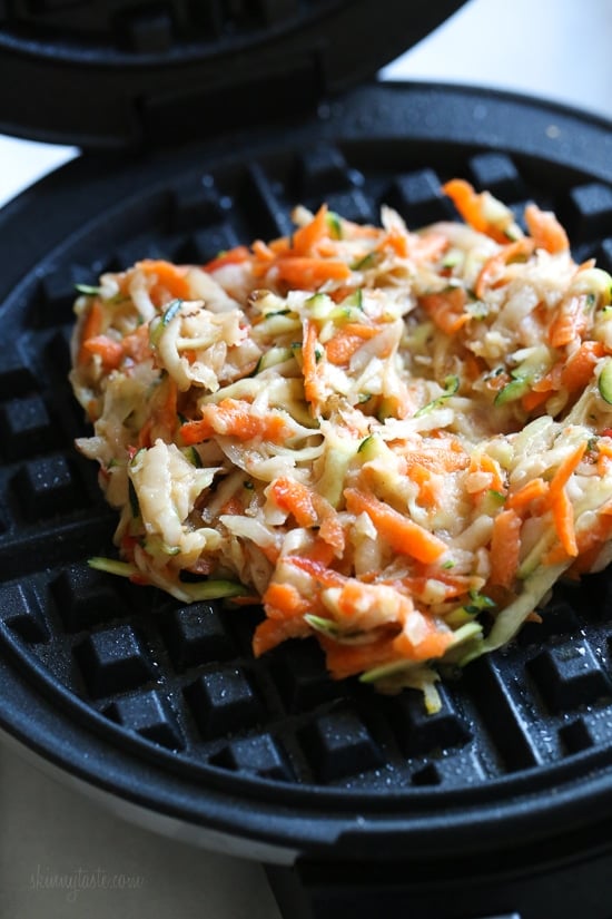 These vegetable-filled latkes aren't your traditional latkes, made from grated potatoes, carrots, zucchini, and peppers, and cooked in a waffle iron so you don't have to fry them! Top them with sour cream, salmon, and capers, or with applesauce on the side. 