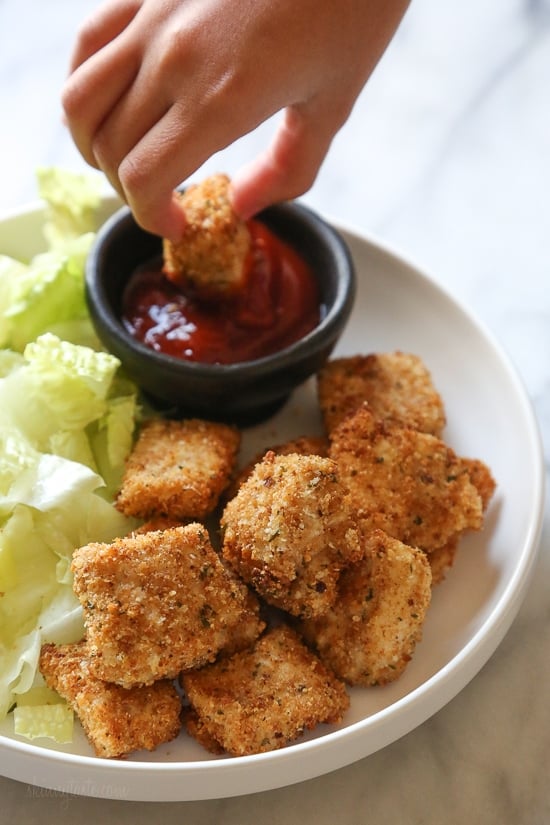 Making homemade Chicken Nuggets in the air-fryer is so much healthier than fast food or frozen nuggets, and so easy to make. Made with chunks of chicken breasts coated in breadcrumbs and parmesan cheese then air fried until golden and crisp. These also happen to be egg-free, so they are also great for kids with egg allergies. 
