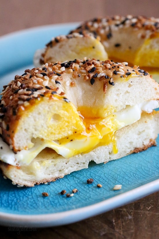 Egg sandwich on an everything bagel with a runny egg.