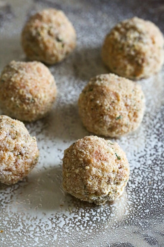 These Italian Cauliflower Rice Balls (Arancini) are made with cauliflower in place of rice! Lower in carbs and baked or made in the air fryer!