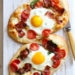 This homemade breakfast pizza is made with bacon, eggs, tomatoes, spinach and cheese, made completely from scratch and ready in less than 30 minutes start to finish!