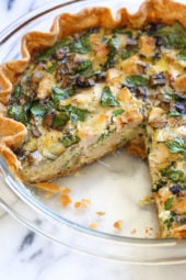 This easy lighter chicken quiche is made with refrigerated pie crust and loaded with spinach and mushrooms but you can use any combination of vegetables. A great recipe to clean out the refrigerator!