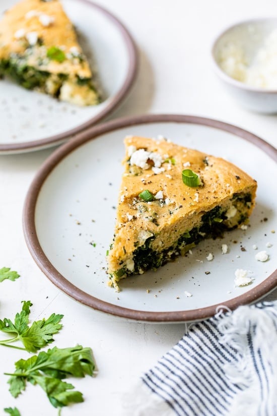 Wedge of Crustless Spinach and Feta Pie on a plate