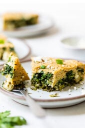 Spinach and Feta Pie cut into a wedge on a plate with a fork.