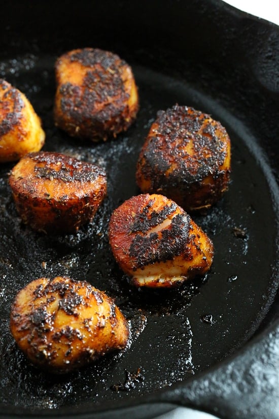 These quick seared Blackened Sea Scallops are coated in a homemade blend of blackened seasoning, then cooked in a cast iron skillet served with a creamy horseradish sauce.