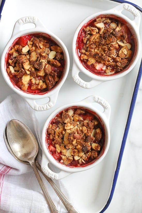 These individual gluten-free strawberry crisps are topped with a crisp nutty topping using a combination of almonds, walnuts and pecans.