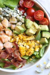 This hearty Chopped Salad with Shrimp, Avocado, Blue Cheese and Bacon is simple and satisfying. Great for lunch or dinner!