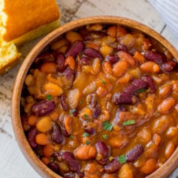 Instant Pot Baked Beans in bowl with cornbread