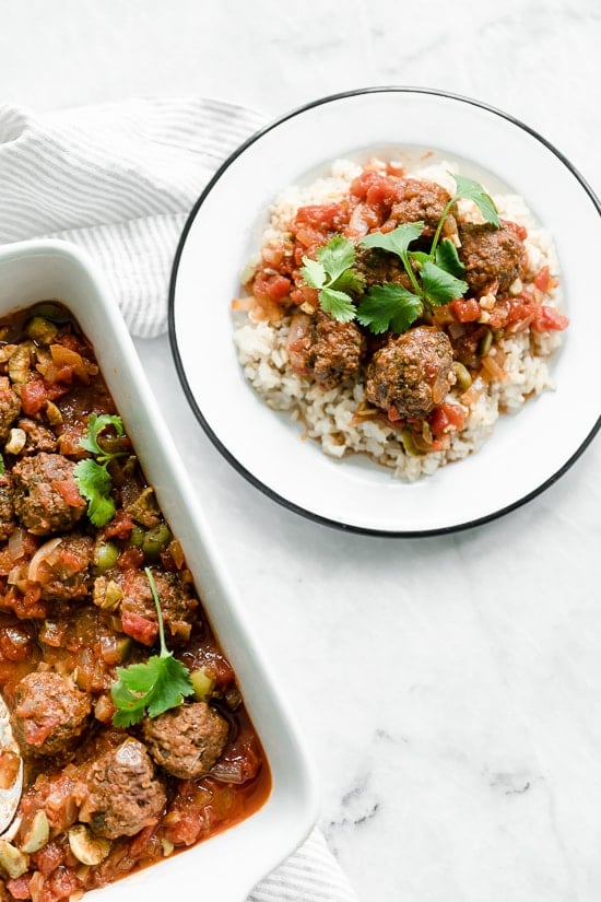 Moroccan Kefta Meatballs made with tomatoes and olives are simmered together in the slow cooker or Instant Pot in this easy and exotic Moroccan dinner.