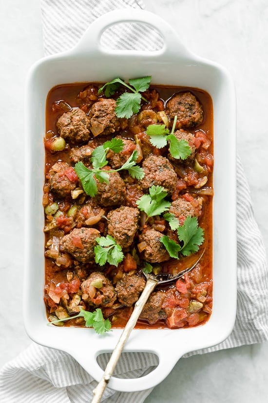 Moroccan Kefta Meatballs made with tomatoes and olives are simmered together in the slow cooker or Instant Pot in this easy and exotic Moroccan dinner.