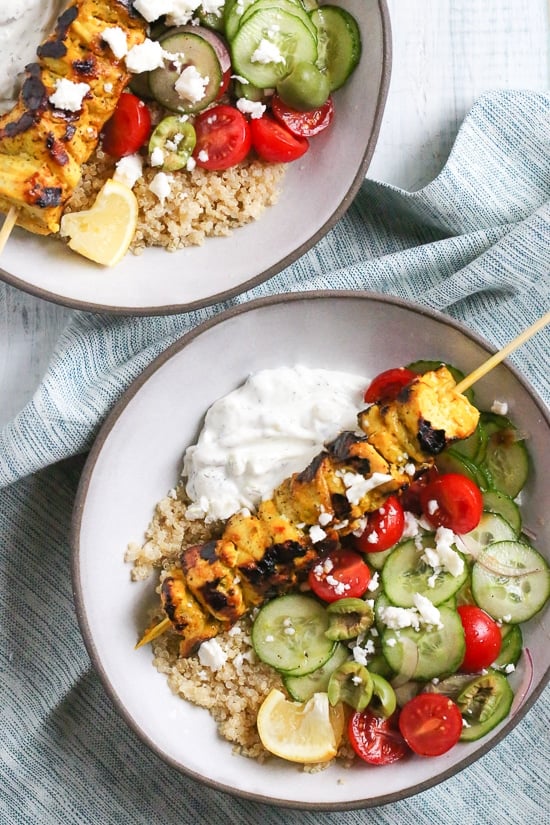 Smoky yogurt-marinated grilled chicken served over quinoa and Mediterranean-inspired tomatoes, cucumbers, and olives with tzatziki and Feta.